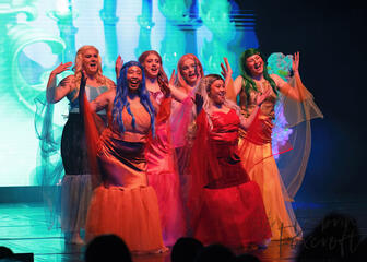 Caryl Loria Illana as Atina the Mersister with her fellow Mersisters in Disney's The Little Mermaid Caryl Loria Illana as Atina the Mersister with her fellow Mersisters in Disney's The Little Mermaid