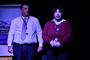 Caryl Loria Illana as DC Melanie Crane in the Martha Syndrome, gripping a notebook, looking nervous